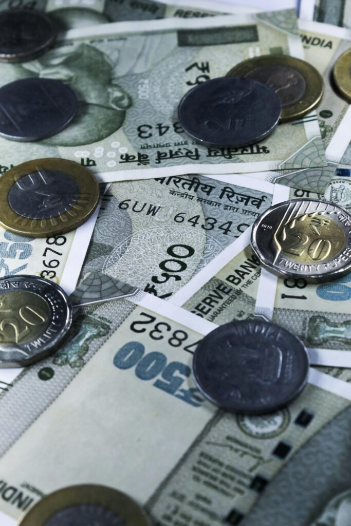 A detailed shot of Indian rupees and coins, capturing wealth and finance themes in Patna, India.